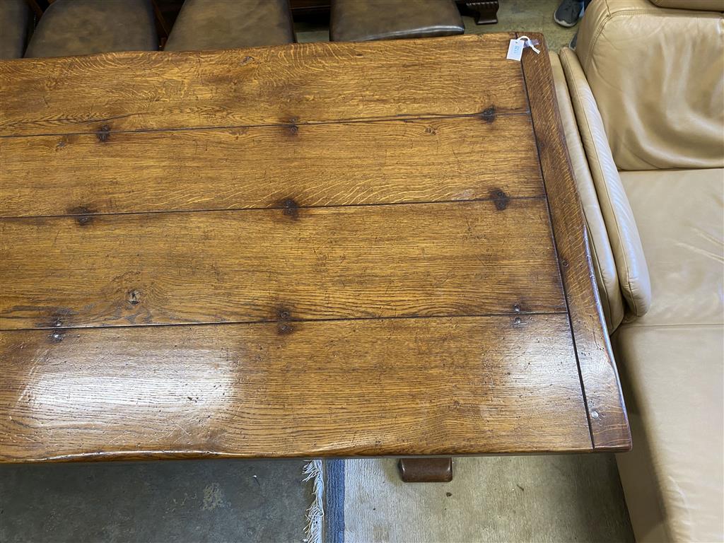 An 18th century style rectangular oak refectory dining table, length 274cm, depth 106cm, height 76cm